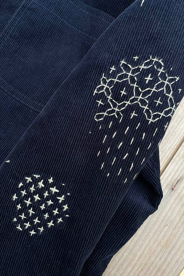 hand sashiko  stitching on arm of a blue cord jacket