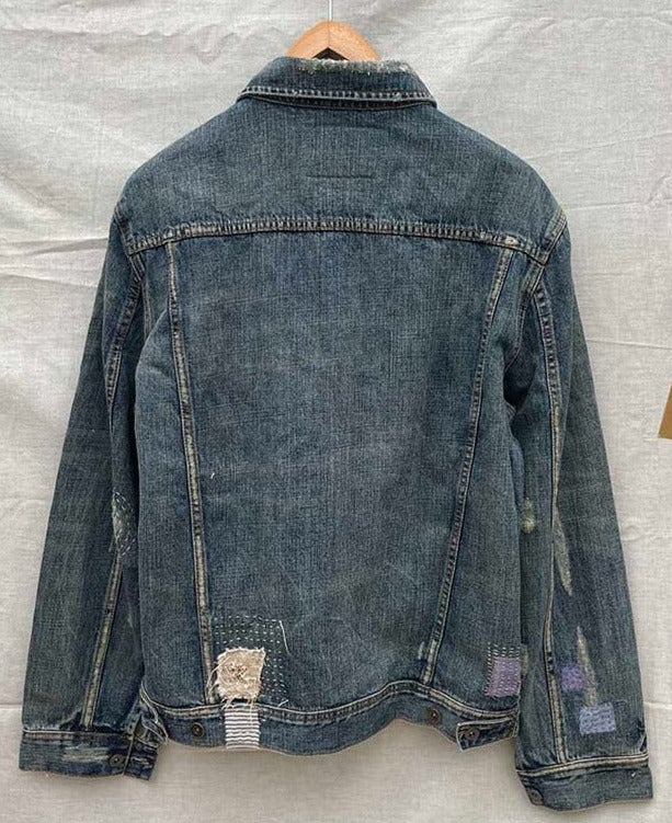 Back of dusty blue boro denim jacket