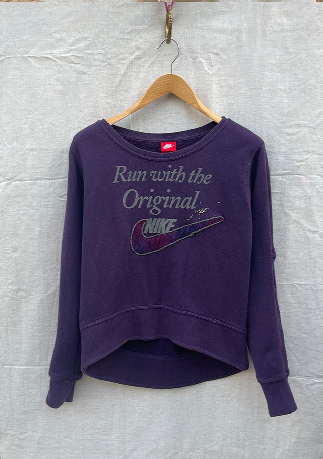 Purple retro sweatshirt with 'Run with the original NIKE' in grey with added quilted swoosh