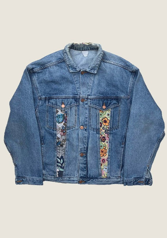 Flat lay denim jacket with floral additions