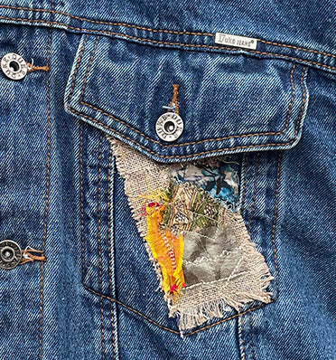 close up of embroidered patchwork pocket